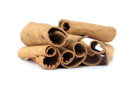 Cinnamon sticks bundle isolated on white backgroundの写真素材
