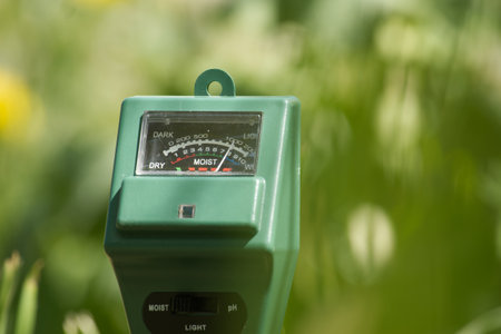 Soil moisture, light intensity and PH testing meter in close up, agriculture technology conceptの写真素材