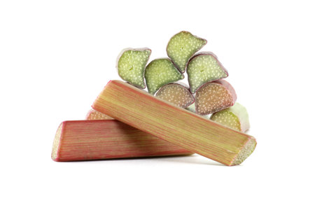 Variety of rhubarb stalks of varying colors from pale green to deep red isolated on white background, health benefits of eating rhubarbの写真素材