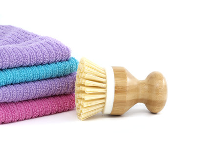 Highly detailed perspective image of multiple dish brushes and dishcloths in pastel colors isolated on white backgroundの写真素材