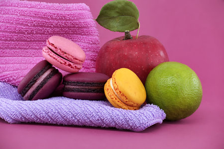 Group of colorful macarons and fruits over pink background. Full depth of fieldの写真素材
