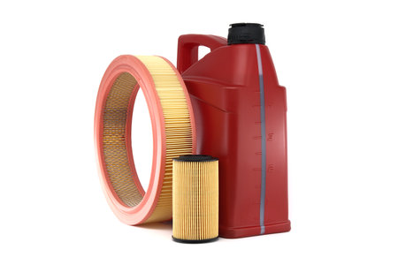 Red motor oil canister and filter isolated on white background, automobile maintenance, automotive sector, oil and filter replacementの写真素材
