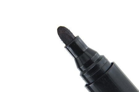 Detailed close-up of black permanent marker with white background. Ideal for office supplies, school projects, and art use.の写真素材