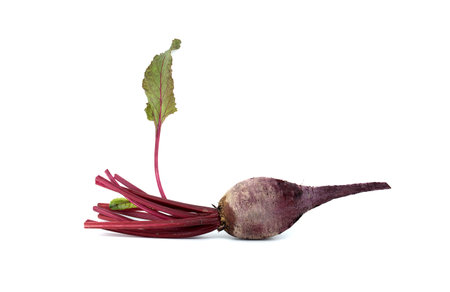 Fresh red beetroot with leaves presented on a white background, highlighting vibrant colors and...