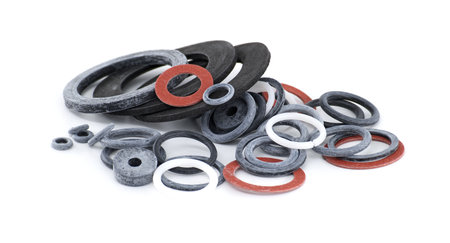 A collection of various rubber gaskets and seals, neatly arranged on a bright white background....