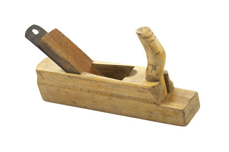 A close-up of a vintage wooden hand plane, showcasing its classic design and craftsmanship against a clean white background.の写真素材