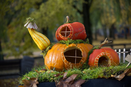 This whimsical pumpkin house is a unique and festive decoration for the fall seasonの写真素材