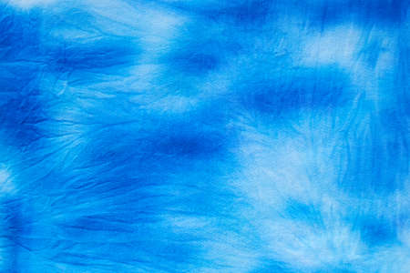 Blue and white abstract hand painted tie dye texture. Folk style design. Creative background for textile, fabric, wallpaper, wrapping paperの写真素材