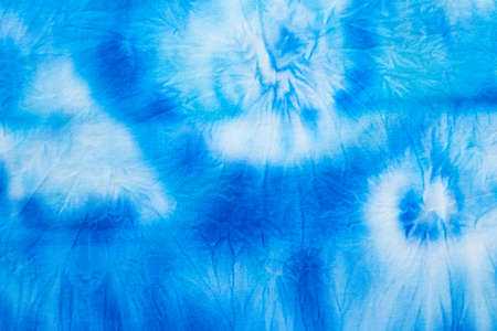 Blue abstract hand painted tie dye texture. Folk style design. Creative background for textile, fabric, wallpaper, wrapping paperの写真素材