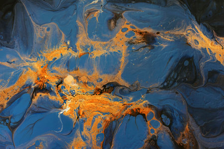 Abstract painting in fluid art technique. Dark blue and orange color creative background for your...