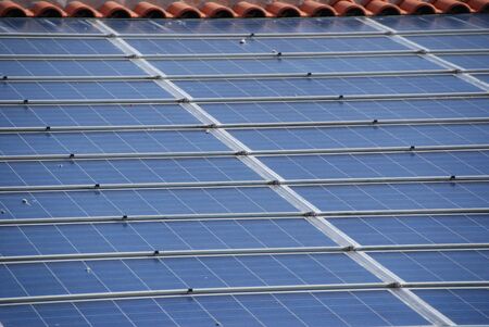 solar panels on top of roof of an old house