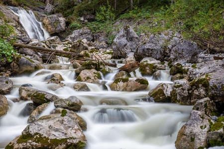 kuhflucht waterfall in forest long exposure alps germany