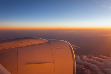 Seeing sunrise on aeroplaneの写真素材