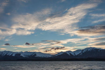Sun rising at the mountain near lakeの写真素材