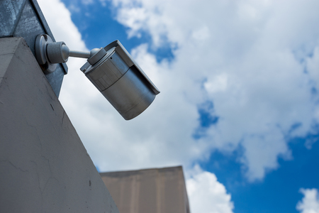 security camera on blue skyの写真素材