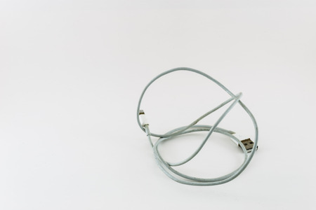 tangle charging cable on whiteの写真素材