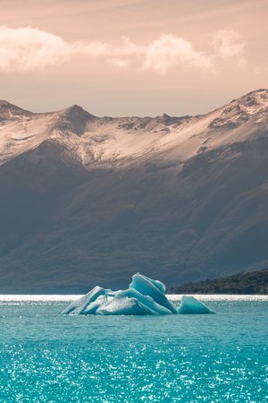 Floating iceberg from glacier Perito Moreno in Patagonia, South America, Autumn, sunsetの写真素材