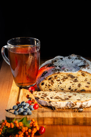 Traditional German Autumn and Christmas cake, berries and tea as still-life, closeup, details,...