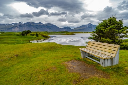 Wonderful view of landscape and bench to sit, on South Eastern Iceland, summer timeの写真素材