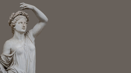 Statue of sensual Roman Renaissance Era woman in circlet of bay leaves, isolated, Potsdam, Germanyの写真素材