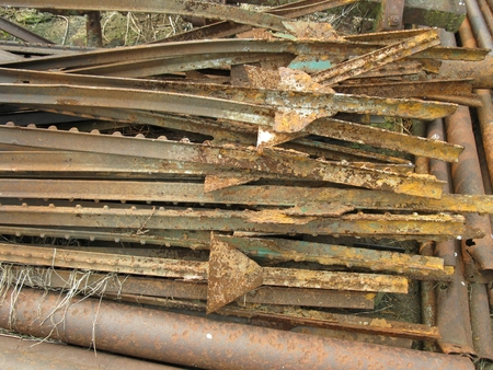 Old rusty fence posts for scrap metalの写真素材