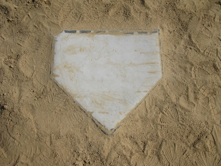 Home plate on sand backgroundの写真素材