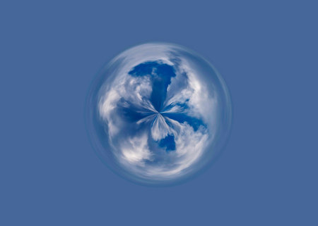 Clouds in the shape of a planet on a blue background.の写真素材