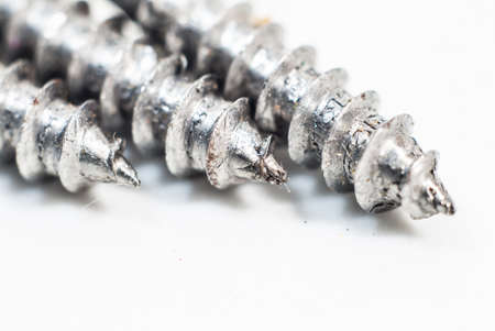 Screws located on a white backgroundの写真素材