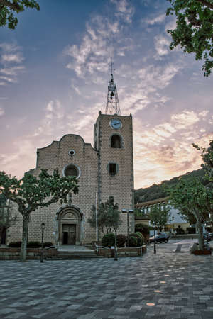 Catalan Gothic church located in the main square of a town called Arenys de Munt (Barcelona, ââCatalonia). Shot taken in the golden hour.のeditorial素材