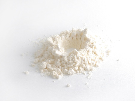 White powder with crater in center of pileの写真素材