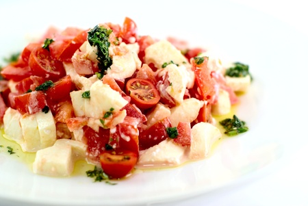 Healthy salad with fresh tomatos, mozarella and basilの写真素材