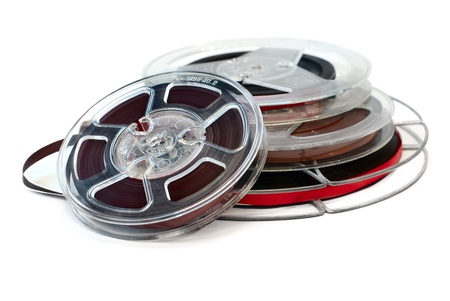 Vintage reels of audio tape isolated on white backgroundの写真素材
