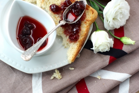 Sweet cherry jam, toast and white flowersの写真素材