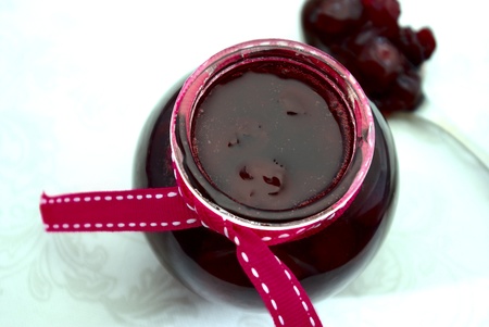 Cherry confiture in glass jar, close-up viewの写真素材