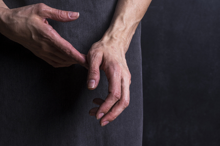Womans hands with blood veins. Emotional gesture. Studio photographyの写真素材