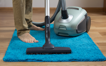 cleaning carpet with cleanerの写真素材
