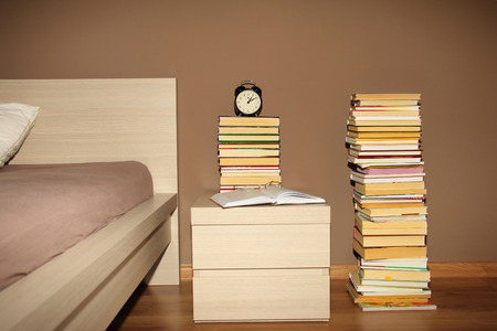 pile of books in bedroomの写真素材