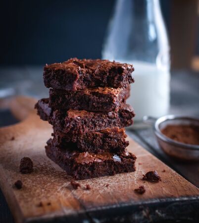 Close-up of homemade chocolate brownies on cutting boardの写真素材