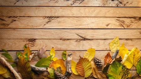 Autumn leaves on wooden background, copy space