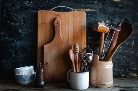 Kitchen utensils and dishware on wooden shelfの写真素材