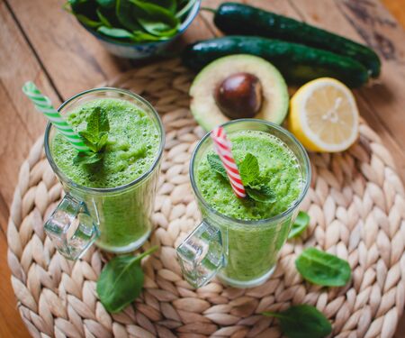 Close-up of green smoothie in a glass with fresh mintの写真素材