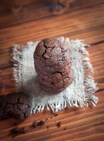 Close-up of homemade chocolate cookies on wooden background, top viewの写真素材