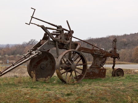 old big rusty plough parked as a monument の写真素材