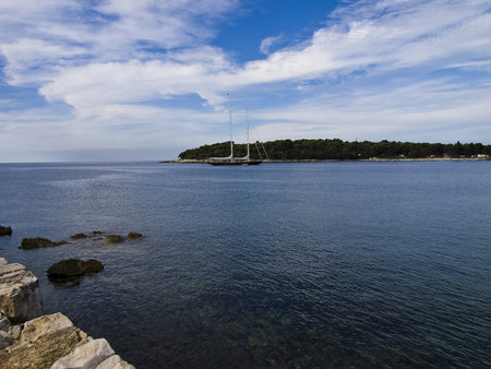 blue boat anchored in the bay in Pula Croatiaの写真素材