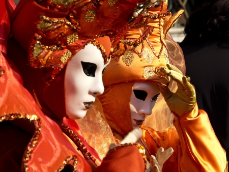 Woman with red carnival mask in Veniceの写真素材