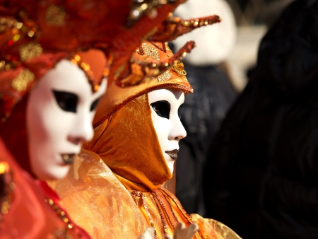 Woman with red carnival mask in Veniceの写真素材