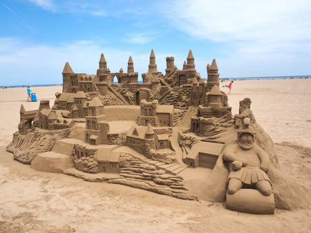 A lavish and large sand castle on an empty beach.の写真素材