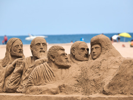 figures in sand on the Valencia beachの写真素材