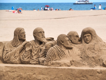 figures in sand on the Valencia beachの写真素材