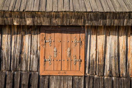 Closeup of traditional wooden shepherd cottages on high alpine pasture Velika Planina near Kamnik during spring in Sloveniaの写真素材
